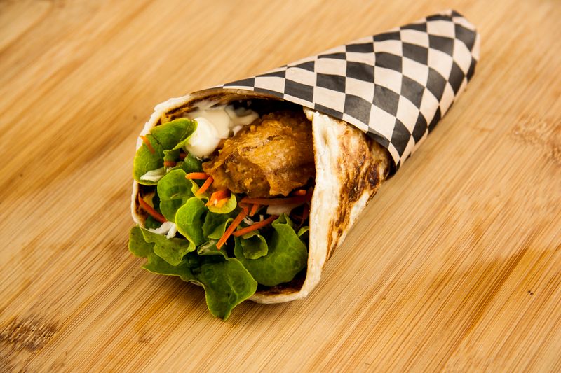 Crispy chicken wrap with fresh garden salad